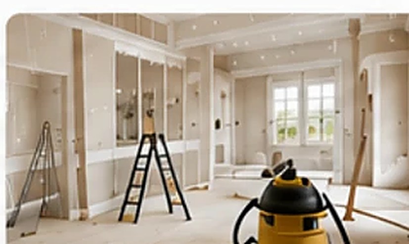 Home interior being cleaned after construction with ladder and shop vacuum